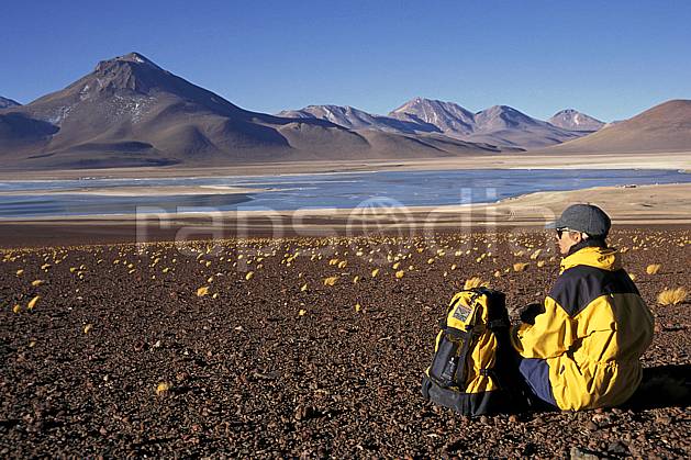 eb1226-27LE royalty free laguna verde, sud lipez, trekking, South America, Latin America, America, sport, leisure, action, aquatic sport, slide, blue sky, laguna, lagoon, rest, backpack, woman, lake, landscape, people, adventure trip (Bolivia).